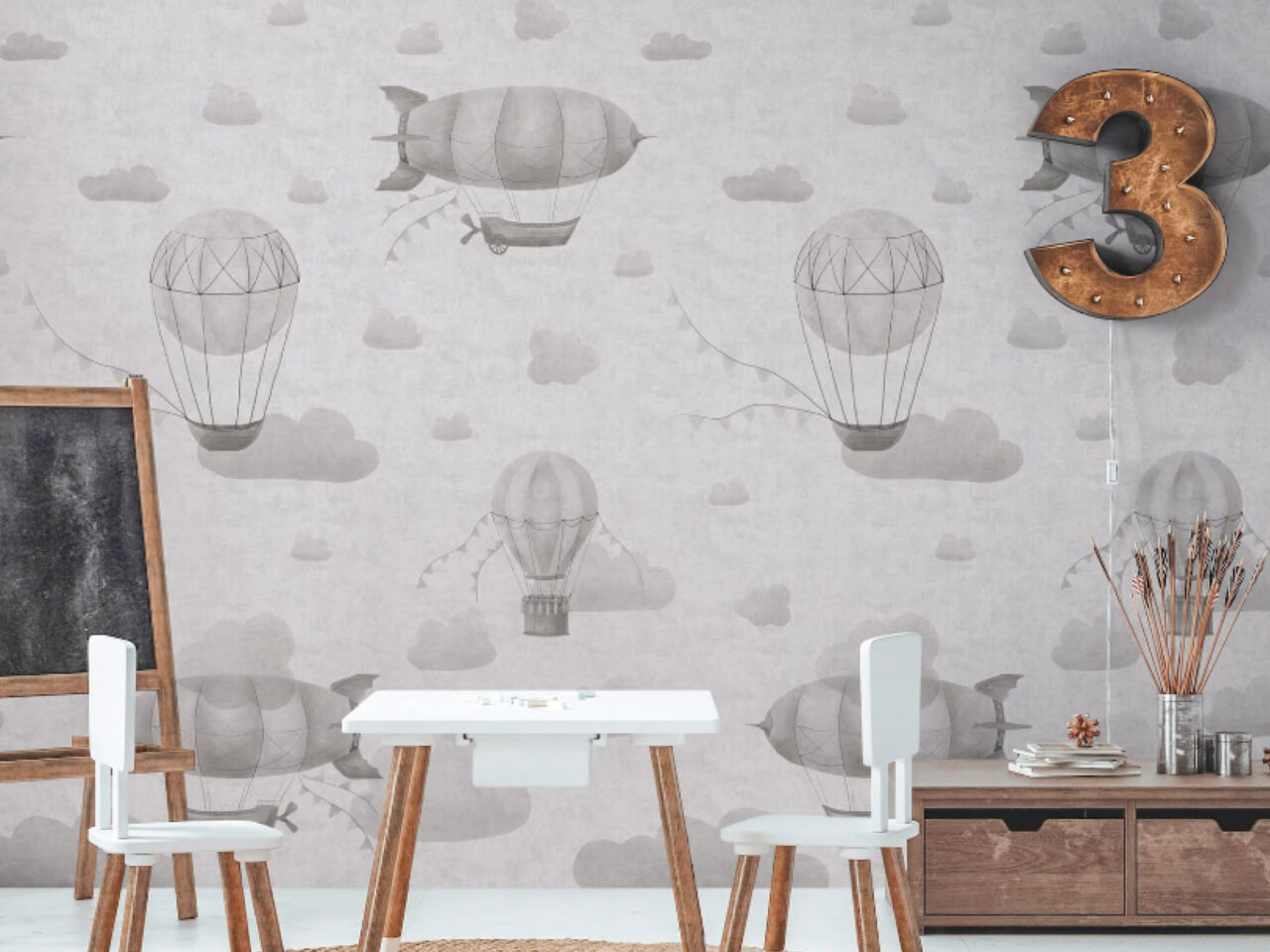 Graue Tapete mit nostalgischen Heißluftballons und einem Luftschiff in einem Kinderzimmer. Foto und Tapete: A.S. Création